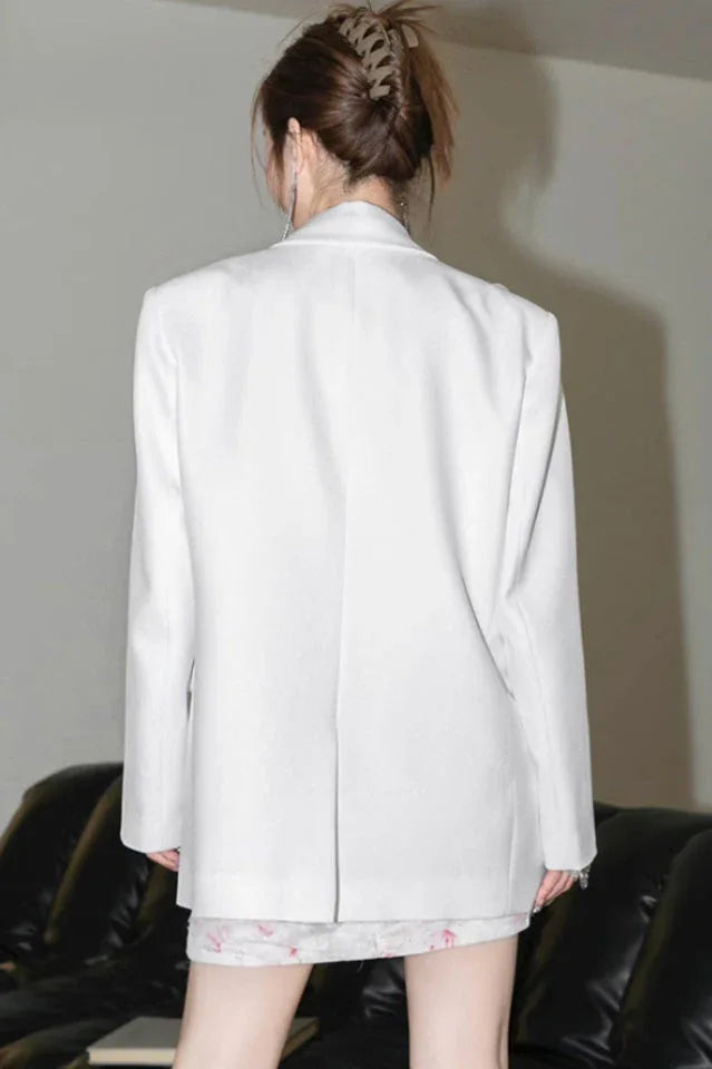 Back view of a white blazer.