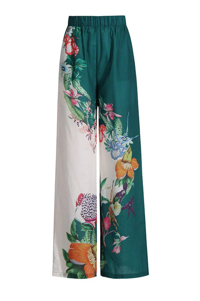 Front view of green and white floral print wide-leg pants.