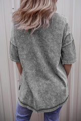 Back view of a woman wearing a grey acid wash oversized t-shirt