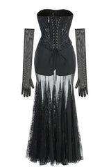 Black lace corset gown with sheer skirt and long sleeves from the back laid flat