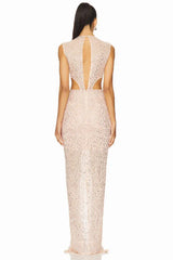 back view of a model in a blush pink sequined gown, showing a keyhole back and cut-out details
