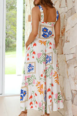 Flat lay of a white floral print two-piece set, featuring a cropped top and wide-leg pants.