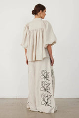 Back view of the linen co-ord set showing the puff sleeves and wide-leg pants