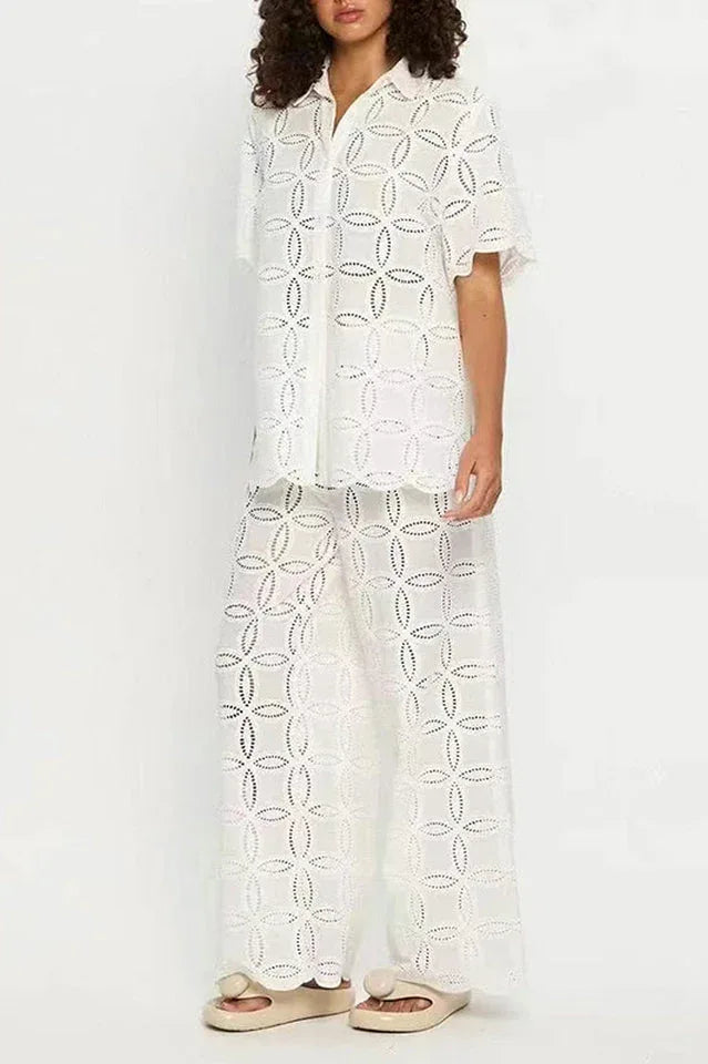 Full-length view of a woman in a white embroidered set