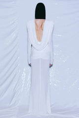 Back view of a white draped gown revealing an open back.