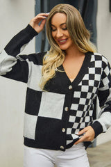 Close-up of a woman wearing a black and white checkerboard print cropped cardigan.