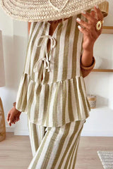 Close-up of the tie-front detail and tiered ruffle on a striped sleeveless top.