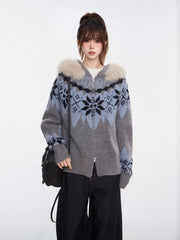 Woman wearing a grey and blue Fair Isle knit zip-up cardigan with a faux fur trim hood and black wide-leg jeans