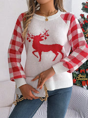 Woman wearing a white and red reindeer graphic knit sweater with gingham plaid sleeves, blue jeans, and a white clutch bag.