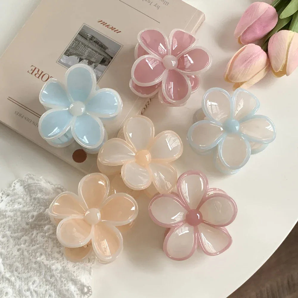flower claw clips arranged with a book and tulips