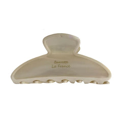 A single cream-colored claw clip with "Barrette La France" inscribed on it.