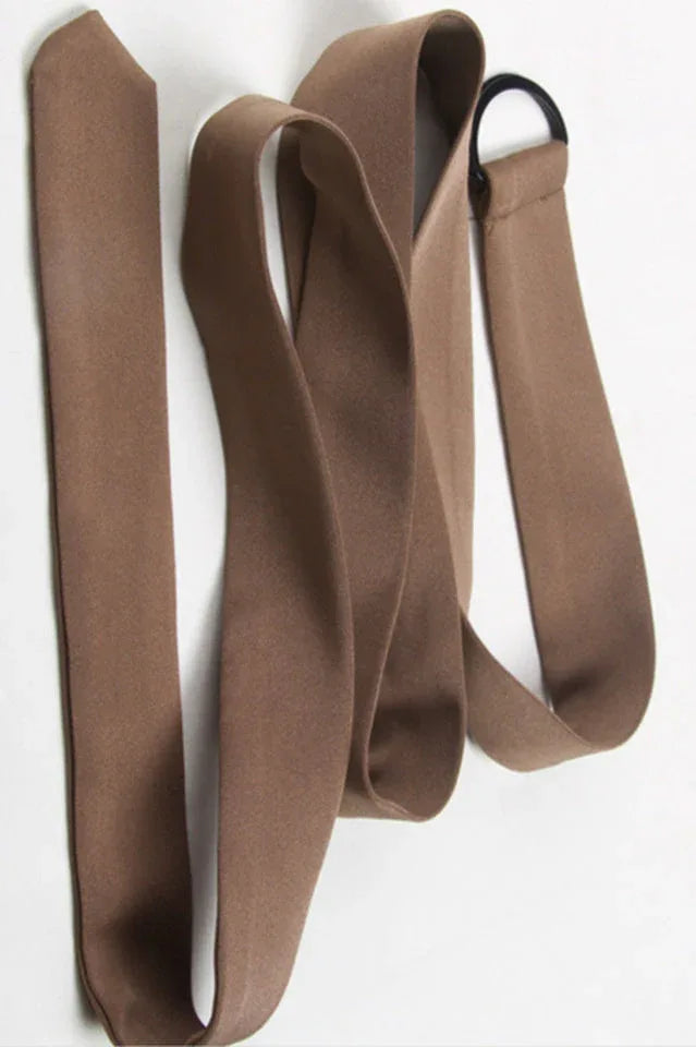 Close-up of the brown fabric belt with a metal ring detail.