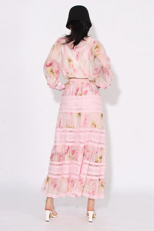 Woman wearing a pink floral print maxi dress from the back