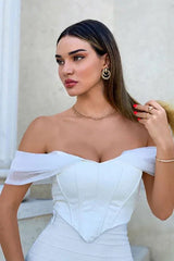 Close-up of a woman wearing a white off-the-shoulder corset top with sheer sleeves