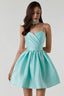 Woman wearing a short, aqua satin dress with a sweetheart neckline, embellished spaghetti straps, and a full A-line skirt.