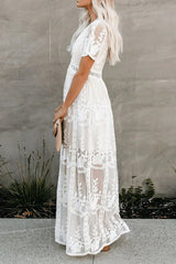 side view of a woman in a white lace maxi dress