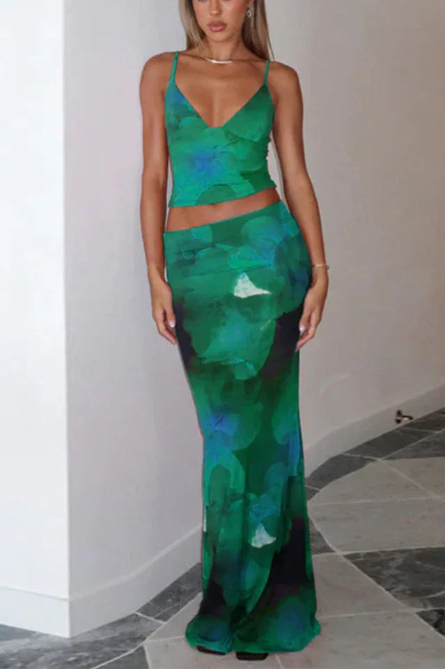 Woman wearing a green floral print crop top and matching maxi skirt