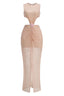 front detail of a blush pink sequined gown with ruched waist, cut-outs, and floral embellishment