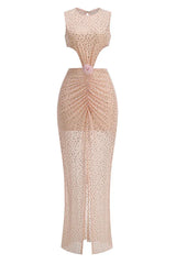 front detail of a blush pink sequined gown with ruched waist, cut-outs, and floral embellishment