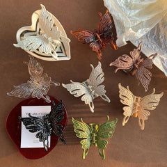 assortment of butterfly hair clips arranged on a surface