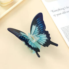 Detailed view of a blue butterfly hair claw clip
