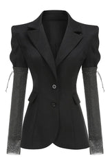 Product shot of a black blazer with embellished sleeves