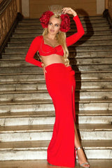 woman in red two-piece evening gown with headpiece