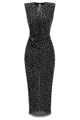 Front view of a black sequined column dress with a cutout waist and button detail