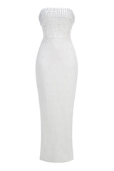 Full-length studio shot of a white strapless pearl-embellished column gown
