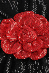 Close-up of a red sequined floral applique on a black sequined garment.