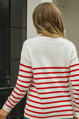 Back view of a woman wearing a white and red striped knit sweater with a crew neck and long sleeves.
