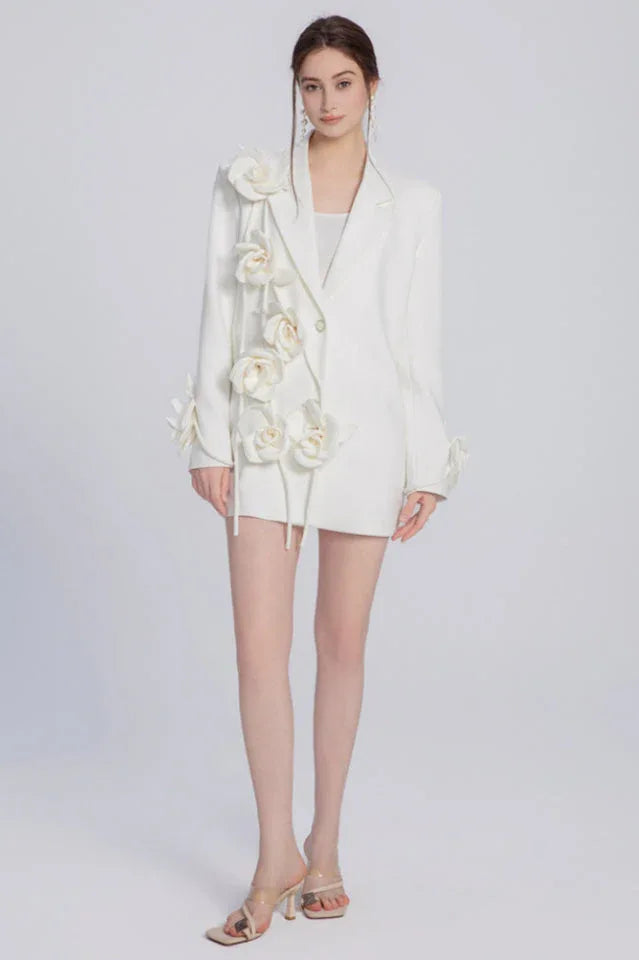 Full body shot of a woman in a white floral blazer dress