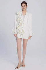 Full body shot of a woman in a white floral blazer dress