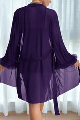 Back view of a woman in a purple sheer robe with ruffled cuffs and a tie waist