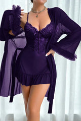 Woman wearing a purple lace and mesh chemise with a matching sheer robe draped over her shoulders