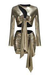 Product shot of a gold metallic two-piece set with a tie-front crop top and ruched mini skirt.