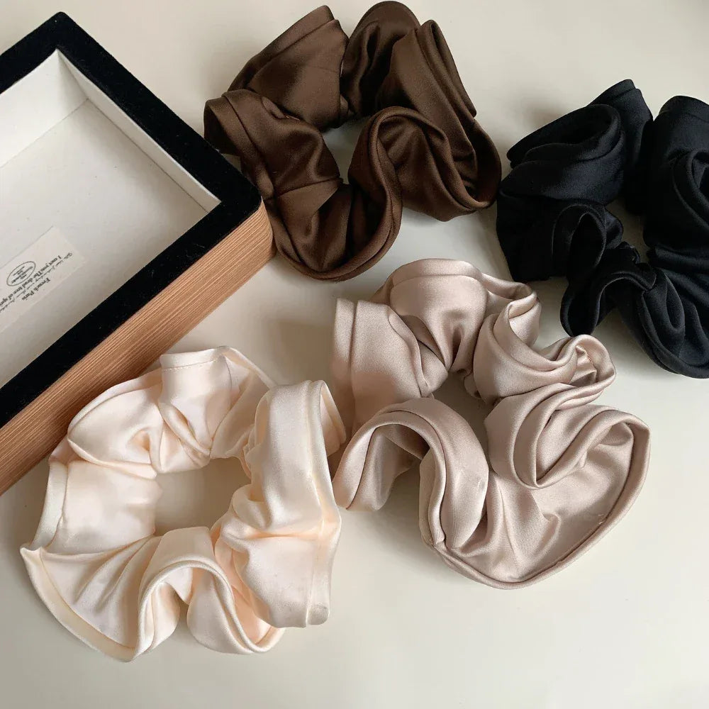 various satin scrunchies in neutral tones