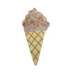 A yellow and orange speckled ice cream cone hair clip.