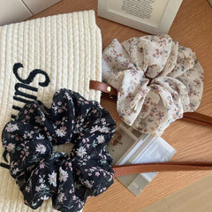 Two floral print chiffon scrunchies on a tote bag