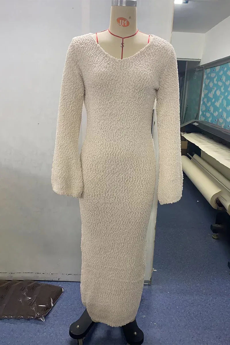 a cream textured knit maxi dress displayed on a mannequin