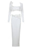 Studio shot of a white formal gown with a square neckline and long sleeves.
