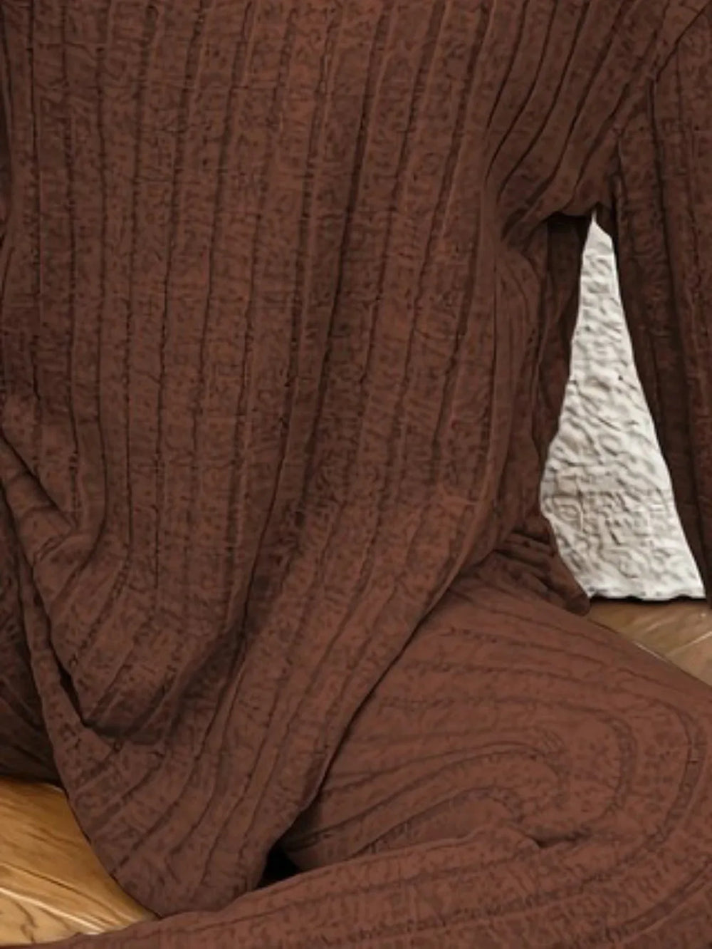 Detailed view of the ribbed knit texture of the brown loungewear set.