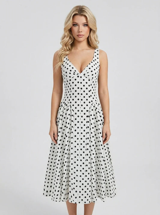 Woman wearing a white polka dot dress