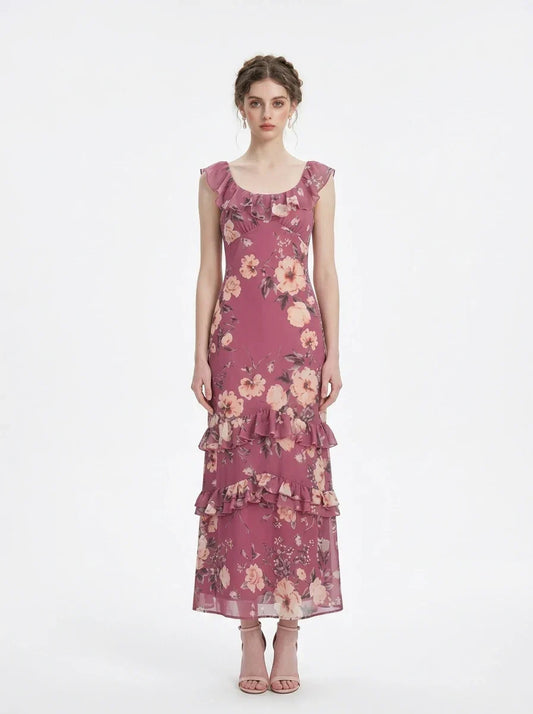 Woman wearing a pink floral print maxi dress with ruffle trim, front view