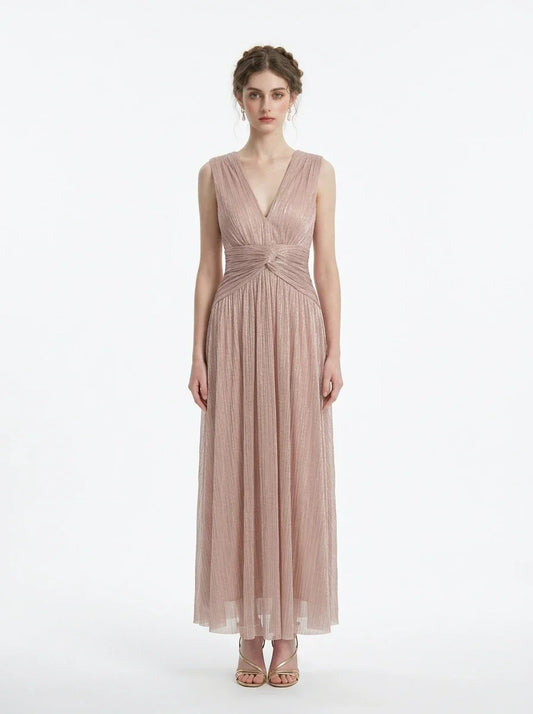 Woman in a rose gold shimmering metallic A-line V-neck sleeveless floor-length formal gown, front view