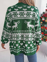 Back view of a woman wearing a green and white Fair Isle knit cardigan with a reindeer and snowflake pattern.