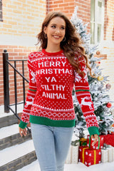 Woman smiling and wearing a festive red Christmas sweater with "Merry Christmas Ya Filthy Animal" text, posing outdoors.