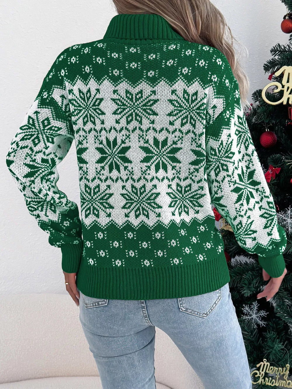 Back view of a woman in a green and white snowflake print turtleneck sweater