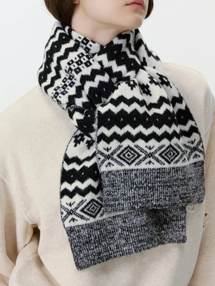 Close-up of a black and white Fair Isle knit scarf with geometric patterns