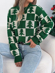 Woman wearing a green and white checkered Christmas tree sweater
